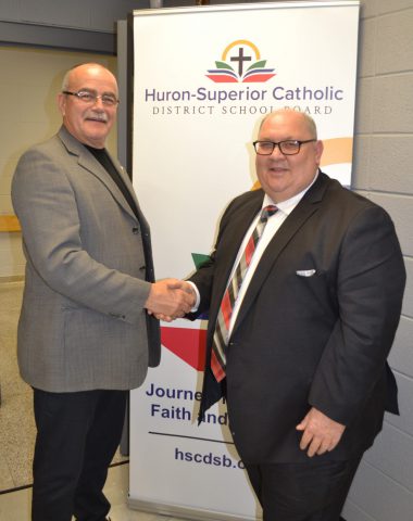 John Caputo and Gary Trembinski shake hands after being elected Vice-Chair and Chair of the HSCDSB Board of Trustees