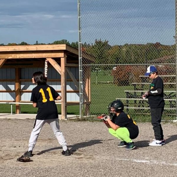 Holy Family student at bat
